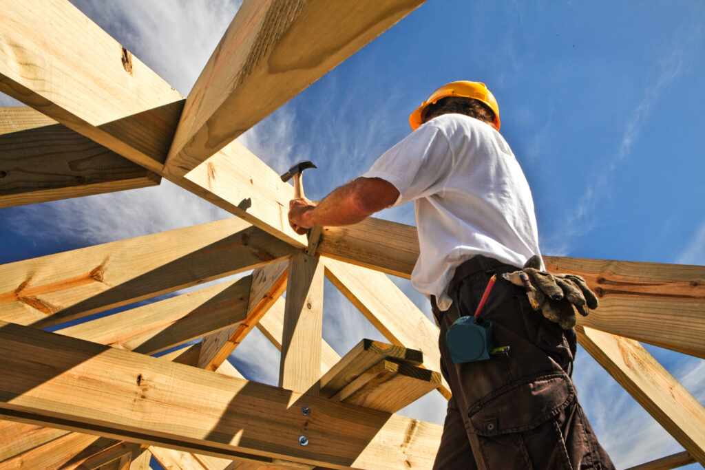 roofer ,carpenter working on roof structure at construction site Builders in Dehradun uttarakhand